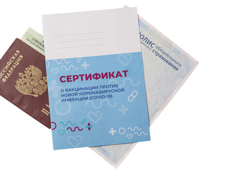 The documents and the certificate of vaccination. Inscription in Russian: certificate of vaccination against a new coronavirus infection COVID-19 