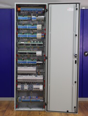 Installation of an electrical panel with difautomatics and automatic protection devices on a metal...