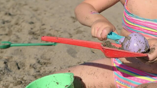 child playing on the beach