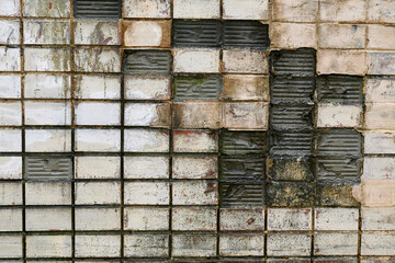 Old cracked ceramic tiles, broken wall background.