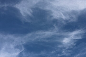 Obraz premium natural background blue sky with stretched stripes of clouds