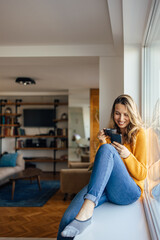 Adult woman, trying to stay in touch with the news.