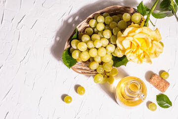 White wine and grape in a wicker basket