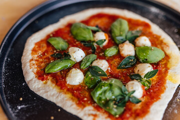 Picture of a pizza cooked on a fire.