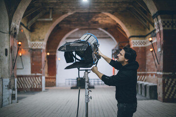 Illuminators with lighting equipment, lighting devices on the set. Lighting production for filming movies