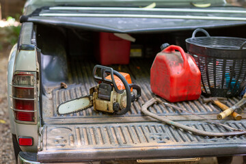 selective focus electric saw, Smallfuel tank placed in the back of the pickup truck. wood cutting...