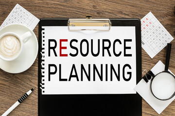 RESOURCE PLANNING. text on white paper on wood background