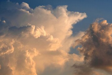 Beautiful clouds against the dark blue sky. Pink shades.