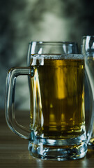Glasses of  dark beer, cold craft beer in a glass on wood table