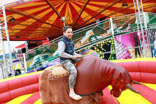 Child riding on mechanical bull