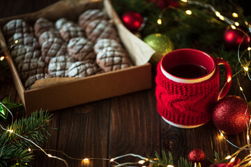 Christmas gingerbread cone cookies with Christmas decorations. New Year and Christmas celebration concept. Soft focus. Top view