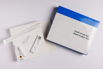 Coronavirus lateral flow self test kit on white background - obrazy, fototapety, plakaty