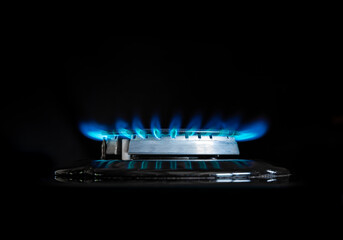 Gas flame on a gas stove with black background