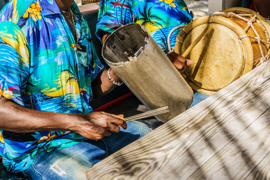 Dominican Republic. The beach musician plays the drum. Drummer. Close-up of a hand and a drum. Merengue. Dominican people.