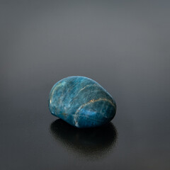 apatite gemstone on dark background