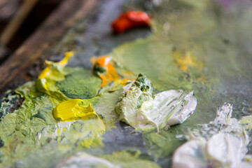 The box easel with oil paints, palette