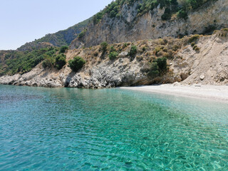 Obraz premium Beautiful views of the azure coast, rocks, pine trees and white sand. The Aegean sea. Turkey, Kusadasi.
