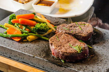 Steak cooked on lava-stone.
