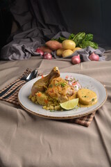 stewed chicken with sauce and fried rice with mash potato and vegetables salad Peruvian cuisine menu