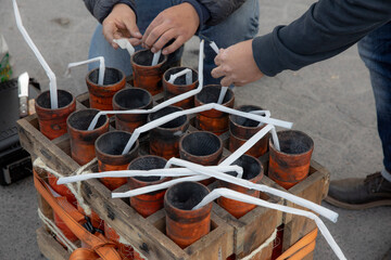 Pyrotechnicians work with fireworks fuses in order to perform a fireworks show in Tultepec, Mexico. 