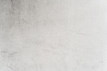 White wall with mildew and humidity stains caused by age. Textured wallpaper background.