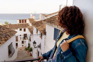 Horizontal view of unrecognizable woman traveling in Spain. Travel and holidays concept in summer. - obrazy, fototapety, plakaty