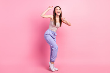 Fototapeta na wymiar Full size photo of young happy excited good mood woman dancing enjoying free time isolated on pink color background