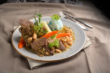 stewed beef steak with baked bean and blue pea butterfly flower rice Peruvian cuisine menu