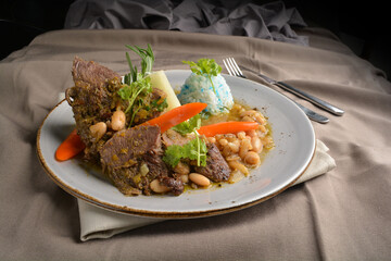 stewed beef steak with baked bean and blue pea butterfly flower rice Peruvian cuisine menu