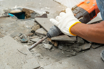Drill machine using to drilling floor tiles in toilet, construction and masonry work, toilet ...