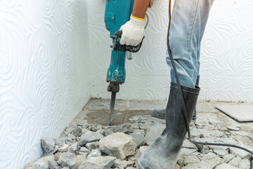 Drill machine using to drilling floor tiles in toilet, construction and masonry work, toilet ...