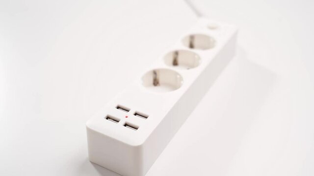 turn on. a versatile modern white extension cord with sockets and usb ports