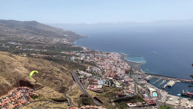 Paragliders Fly Over Santa Cruz De La Palma, Canary Islands. Parachutes And Paragliding Experience. 4K UHD