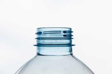 Transparent plastic bottles, on a clear surface. Transparent bottle neck. Recycling and disposal of...