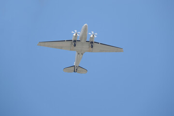 Fototapeta premium two-engine airplane fly over the camera shot