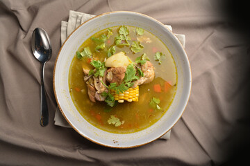 chicken with corn and potato hot soup Peruvian cuisine menu