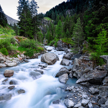 Savara stream in long exposure at dusk. Valsavarenche. "Gran Paradiso" National Park. Aosta Valley. Italy
