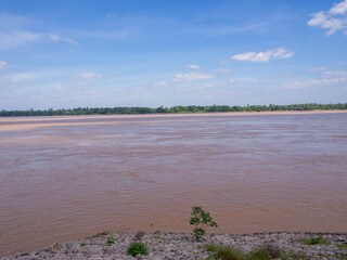 the nice blue sky and the beautiful big orange Mekong River, Thailand.