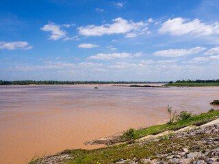 the nice blue sky and the beautiful big orange Mekong River, Thailand.