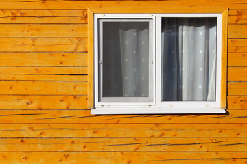 Fototapeta premium Double-glazed windows in a wooden house. Close-up. Background. Texture.