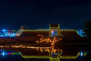 Fototapeta premium Krathong Sai Floating at Pra Tu Tha Nang in Lamphun province, Thailand. Krathongs made from coconut shells