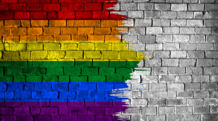 Fototapeta premium Pride celebration. Multicolored brick wall. Rainbow symbol of LGBTQ+ transgender movement painted on the wall.