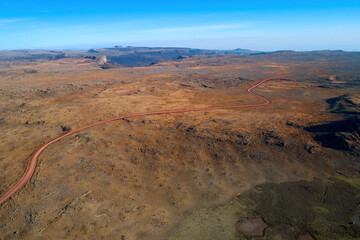 Aerial view of a dirt road crossing the strange, inhospitable landscape of the Sanetti plateau....