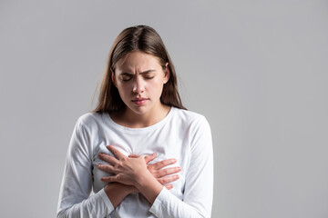 Woman suffering from chest pain. Woman having heart attack. Heart attack concept. Girl feeling...