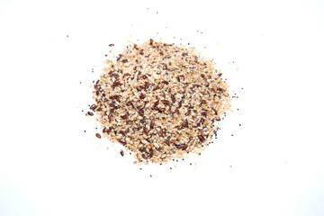 Stack of seed mix for salads and healthy dishes isolated on white background,