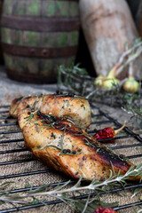  Grilled spicy chicken breast on the rustic surface in the kitchen