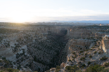 beautiful sunset at a large canyon with many rocks and landscapes