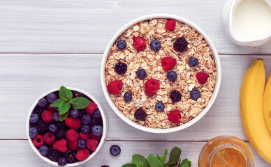 Oatmeal with berries, top view, healthy breakfast, on a white table, no people,