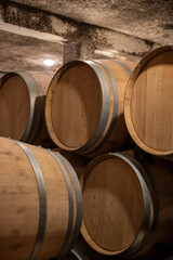 Keeping for years of dry red wine in new oak barrels in caves in Burgundy, made from pinot noir grape