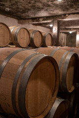 Keeping for years of dry red wine in new oak barrels in caves in Burgundy, made from pinot noir grape